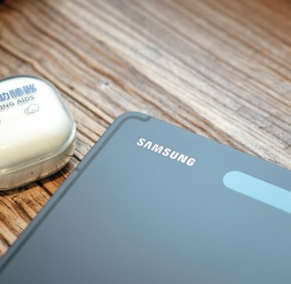 a cell phone and a mouse on a table