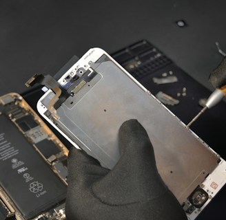 person fixing phone