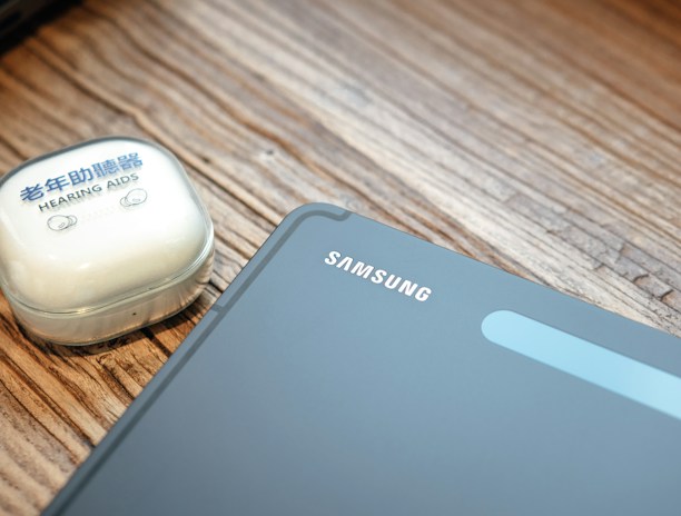 a cell phone and a mouse on a table