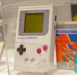An original nintendo game boy is on display.